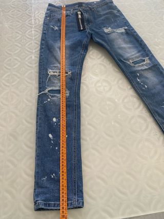 Jeans ragazzo strappati con zip