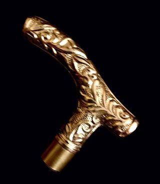 Bastón en "T" en bronce dorado. Perfecto estado