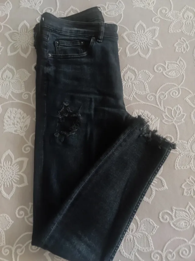 Pantalones vaqueros negros rotos hombre