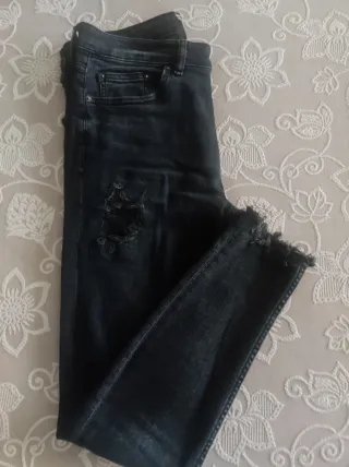 Pantalones vaqueros negros rotos hombre