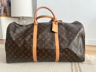 Valigia marrone con monogramma Louis Vuitton