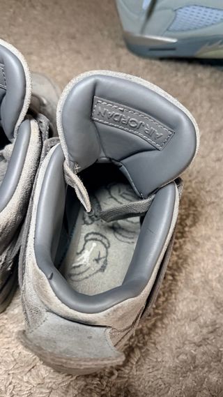 Jordan 4 CAWS Grigio