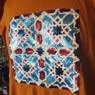 Camiseta naranja con lentejuelas talla L