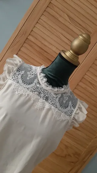 Blusa elegante con pizzo Rinascimento 