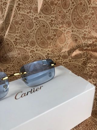Gafas cartier azules y doradas 