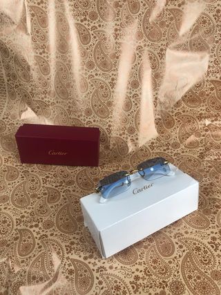 Gafas cartier azules y doradas 