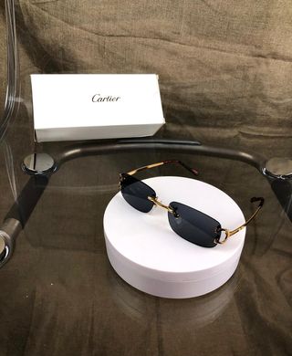 Gafas Cartier negras y doradas  