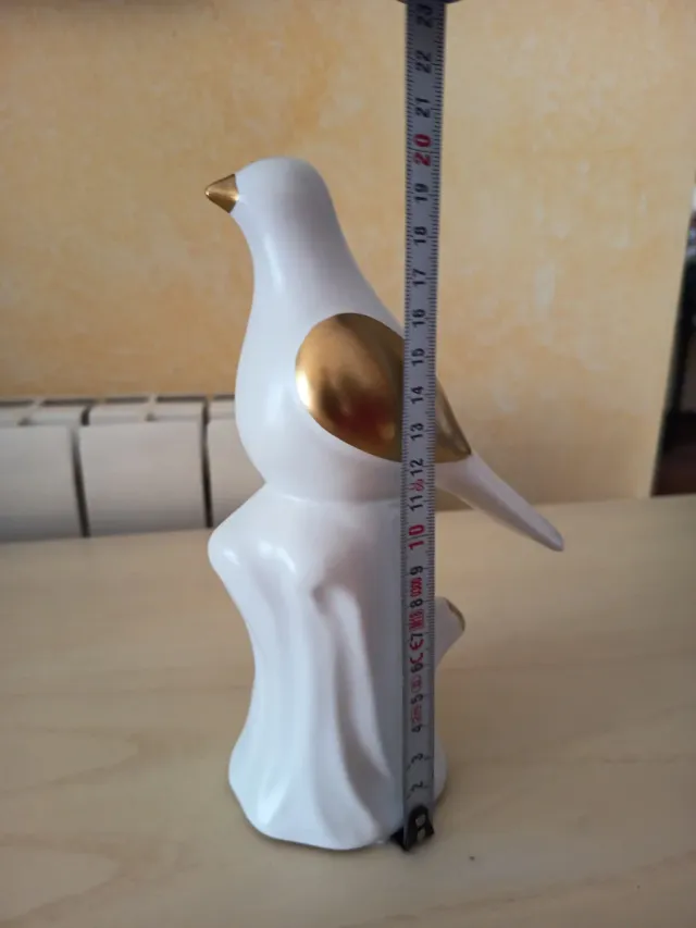 Figura pájaro cerámica blanco y dorado