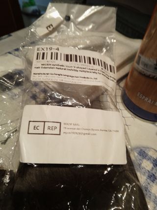 Extensiones de cabello ondulado castaño