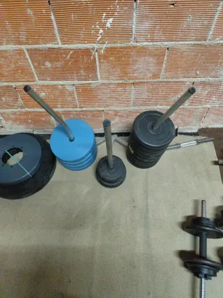 Conjunto de pesas y expositor