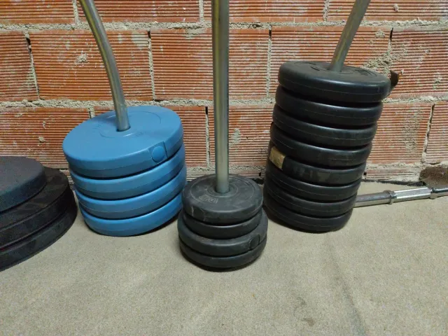 Conjunto de pesas y expositor