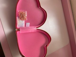 Bolso Charlotte Tilbury Rosa y Dorado