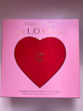 Bolso Charlotte Tilbury Rosa y Dorado