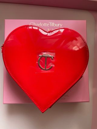 Bolso Charlotte Tilbury Rosa y Dorado