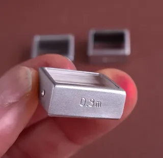 PRISMAS DE CORRECCIÓN DE PARALAJE