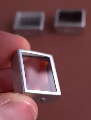 PRISMAS DE CORRECCIÓN DE PARALAJE