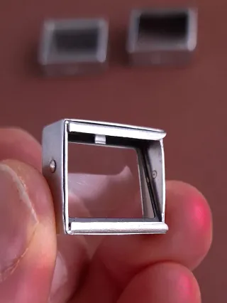 PRISMAS DE CORRECCIÓN DE PARALAJE