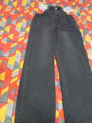 Pantaloni palazzo baggy con catene