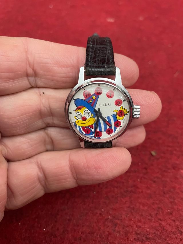 Reloj antiguo con payaso autómata
