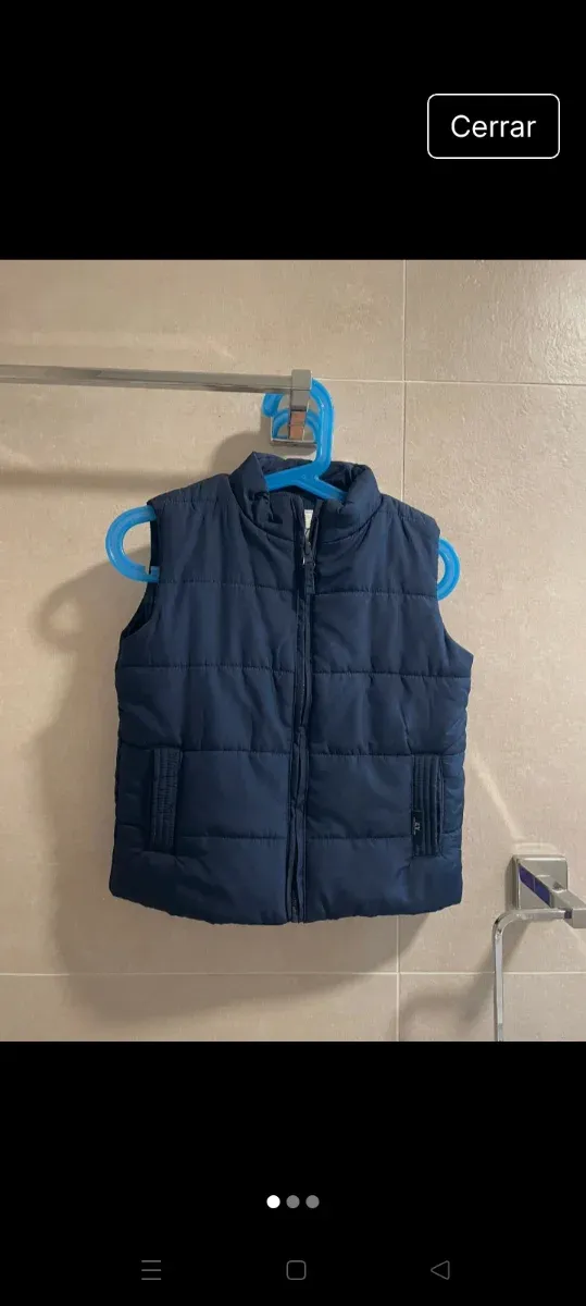 Chaleco niño plumas azul