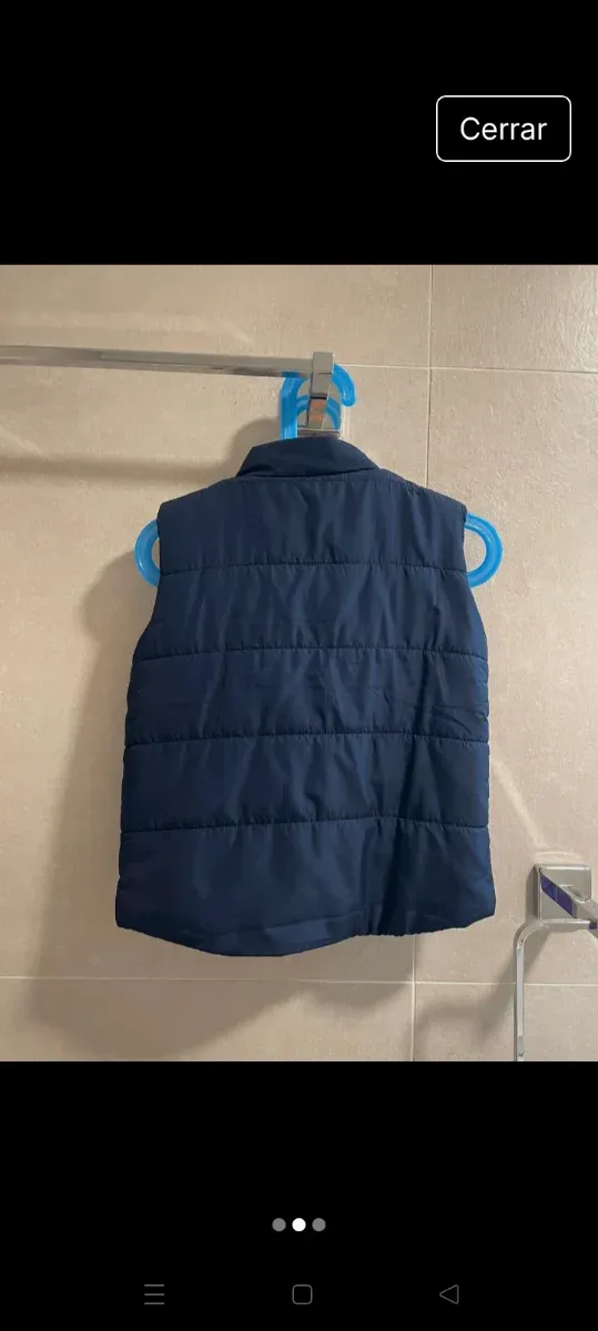 Chaleco niño plumas azul