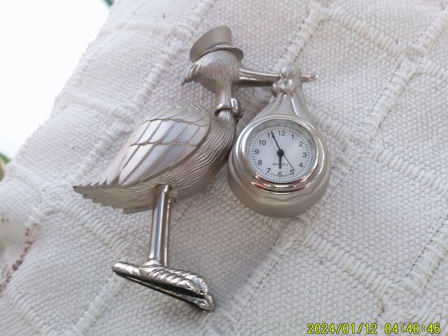Reloj miniatura cigüeña plata