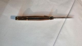 Coltello multiuso con cavatappi