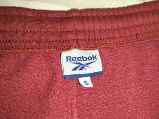 Pantalón chándal Reebok mujer granate
