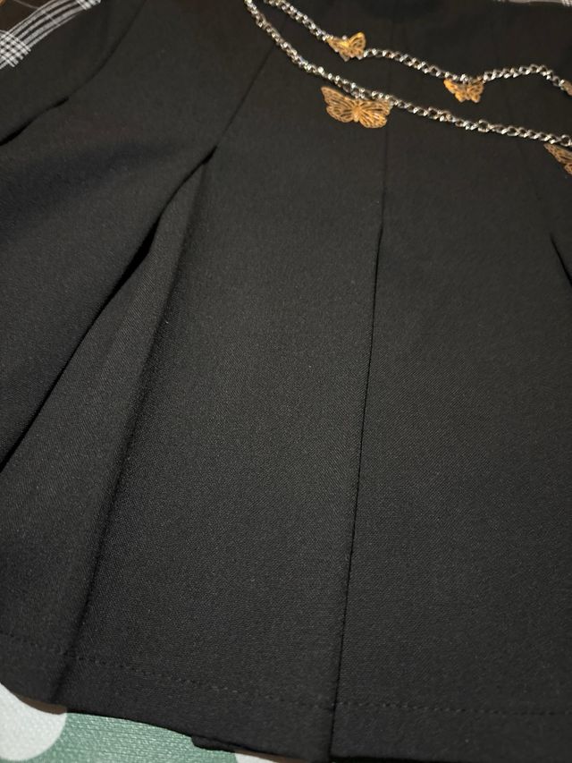 Lote 2 faldas plisadas negra y cuadros