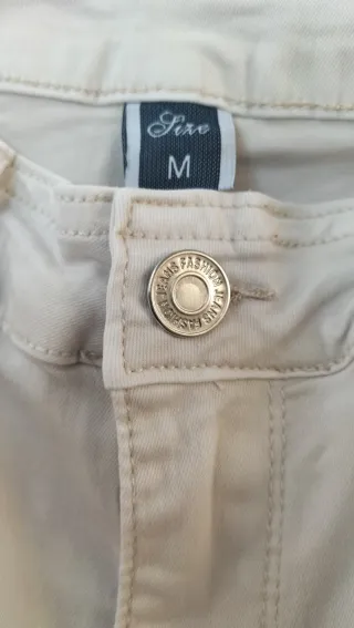Pantalón vaquero acampanado elástico beige
