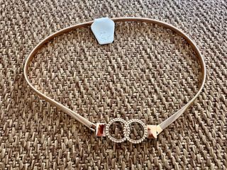 Cinturón metálico elástico dorado con doble círcul