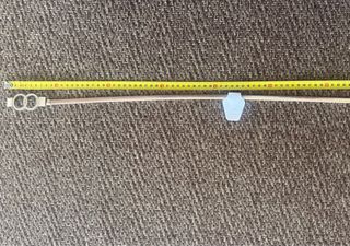 Cinturón metálico elástico dorado con doble círcul