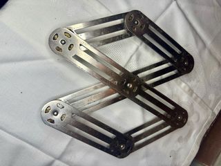 Salvamanteles extensible metálico