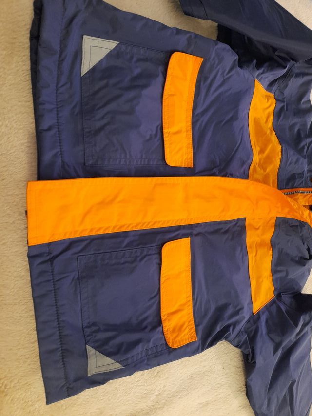 Abrigo infantil azul y naranja interior forro pola