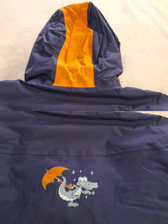 Abrigo infantil azul y naranja interior forro pola