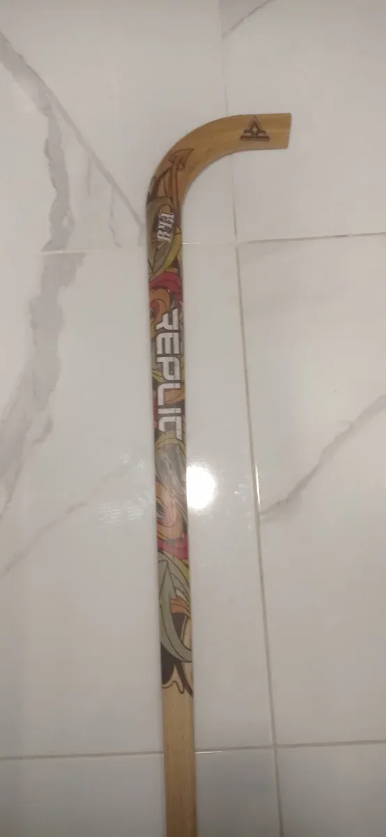 Palo de hockey réplica
