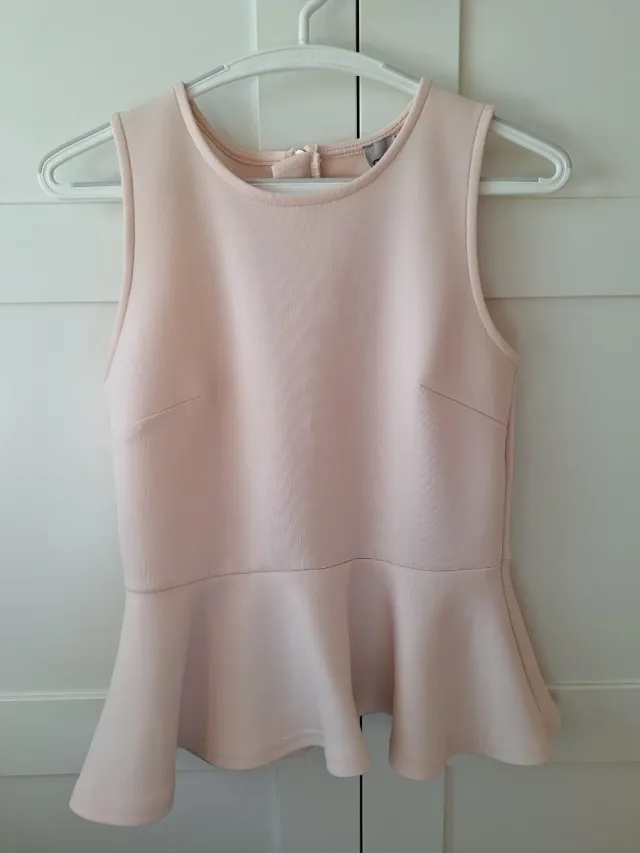 Top rosa peplum sin mangas