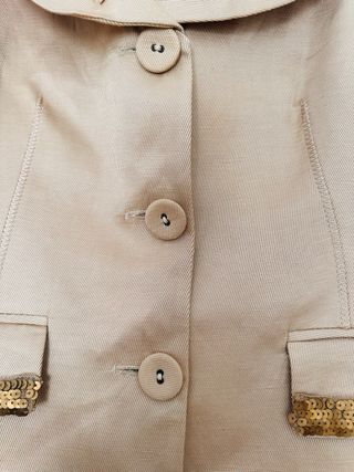 Conjunto chaqueta y falda beige y marrón