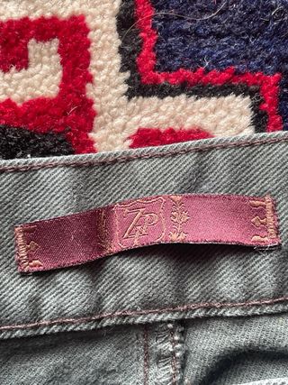 Pantaloni verdi con zip