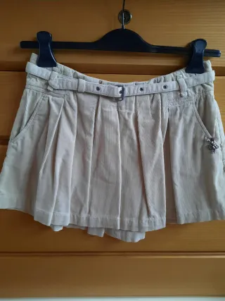 Minigonna a coste con pieghe