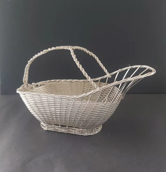 Portabottiglie in metallo argentato intrecciato