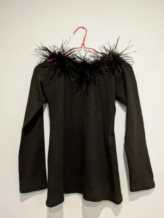 Jersey fino con plumas