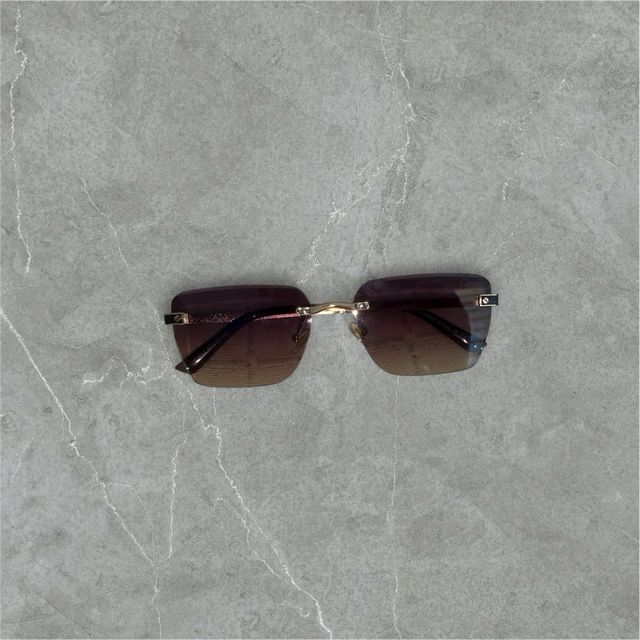 gafas Cartier marrón y doradas