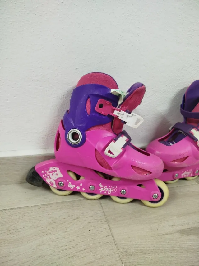 Patines en línea Oxelo rosas y morados.
