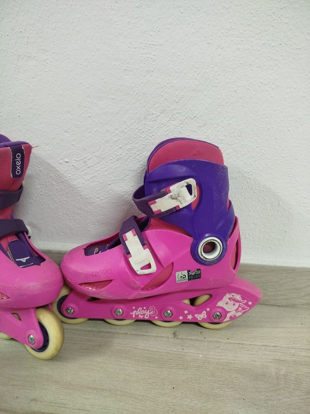 Patines en línea Oxelo rosas y morados.