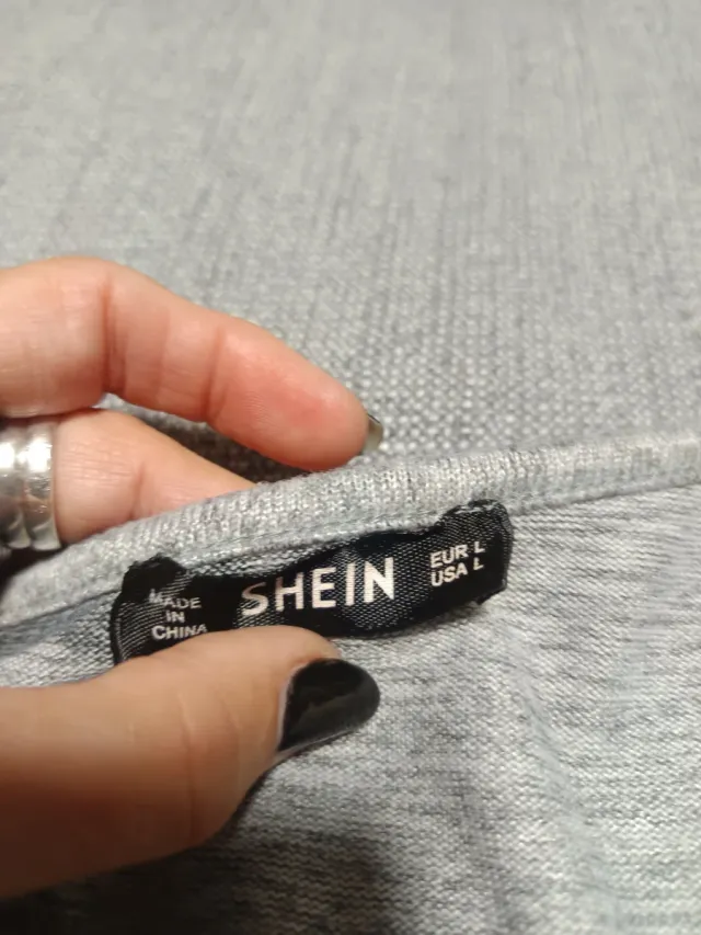 Jersey gris con estrellas negras