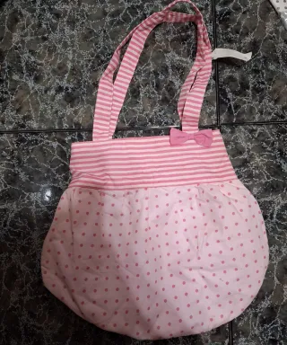 Bolso infantil rosa con lazo