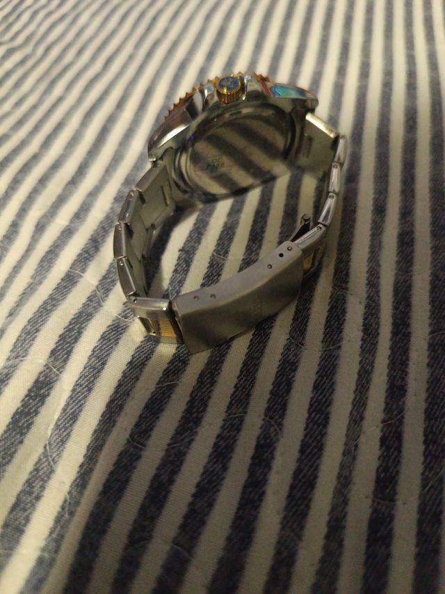 Reloj de Aguja Azul y Dorado para Salir.