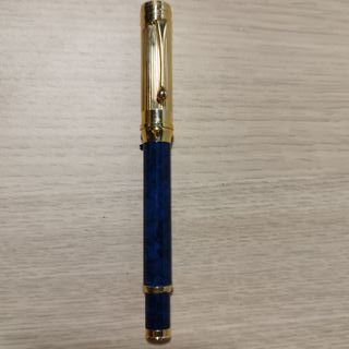 Pluma estilográfica azul y dorada