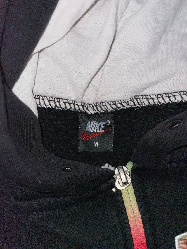 Tuta Nike nera con stampa floreale